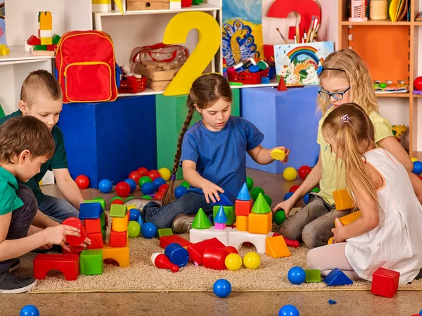 depositphotos_179635336-stock-photo-children-building-blocks-in-kindergarten